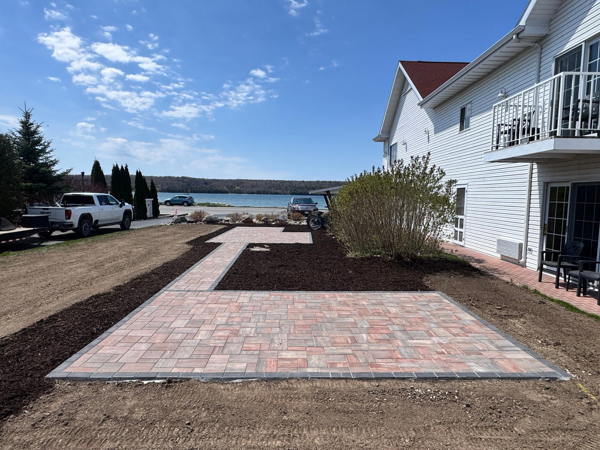 Lakeside paver patio and landscaped yard