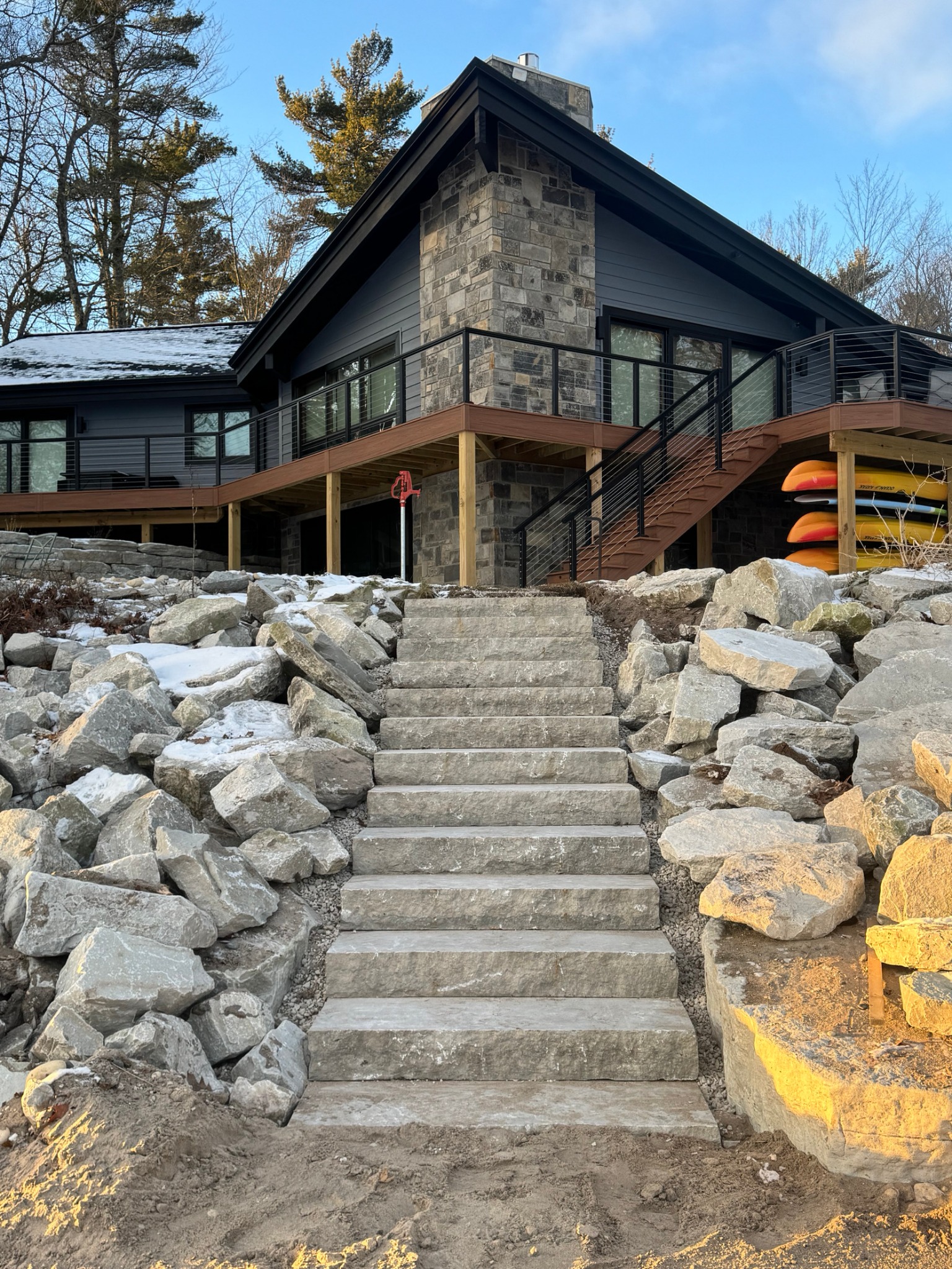 Natural stone steps and shoreline boulder landscaping